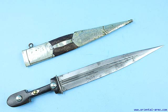 Caucasian qama or kindjal dagger, the 15cm pointed double edged blade with  centre fuller and two-piece horn grip; in nickel plated scabbard with  panels of figures and script L28.5cm overall; and east 